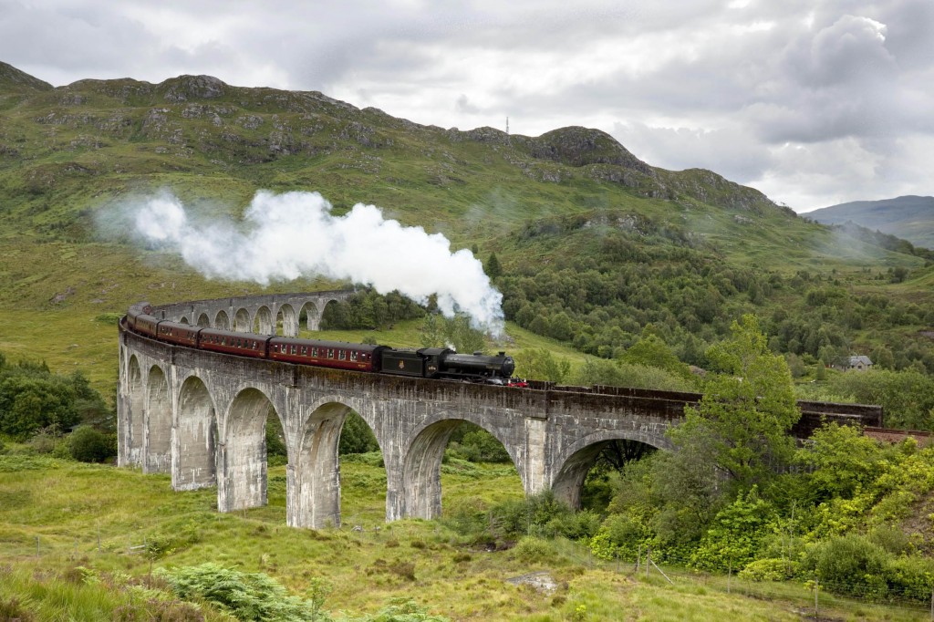 The Jacobite Steam Train Passing Over The Glenfinnan Viaduct At The ...